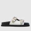 schuh treasure leather studded sandals in white